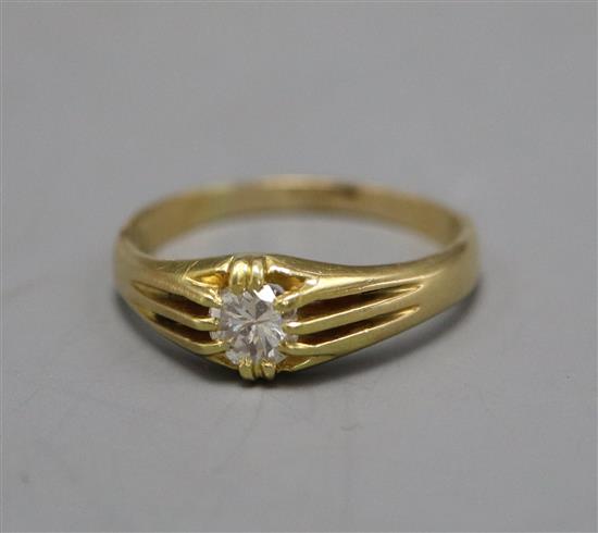 A George V 18ct gold and claw set solitaire diamond ring, the stone weighing approximately 0.50cts, size V.